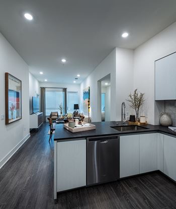 Wood - style flooring in living and dining areas and throughout in select units